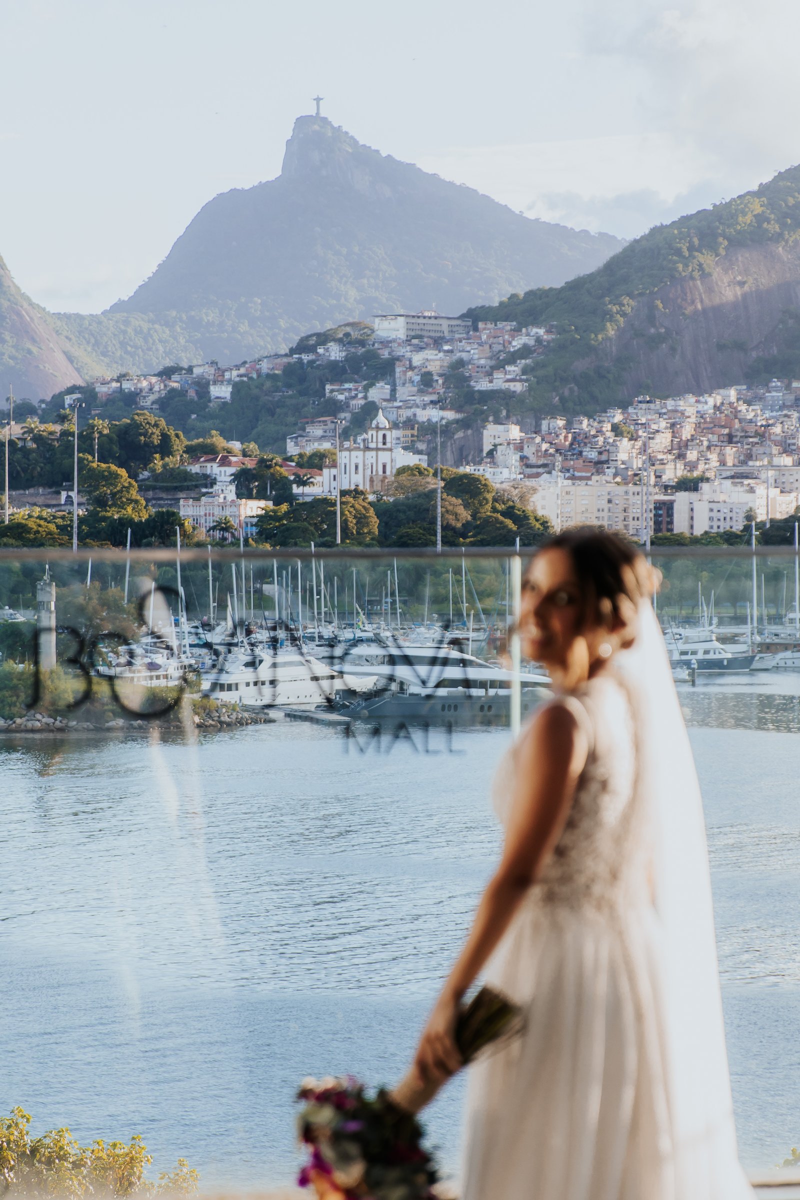 Bride with Christ the Redeemer reflection, Rio de Janeiro wedding